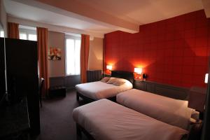 En eller flere senger på et rom på Hotel Le Jacquemart
