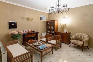 a living room filled with furniture and a fireplace at Tiara Domodedovo Guest House in Domodedovo