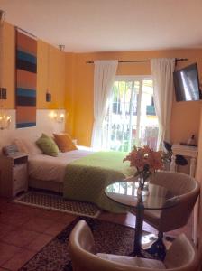 Postel nebo postele na pokoji v ubytování Boutique Hotel Pueblo