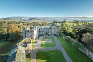 an aerial view of a castle with trees and grass at Appleby Castle in Appleby