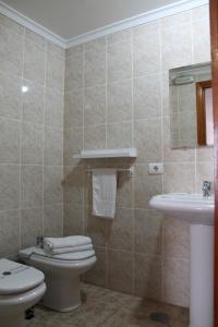a bathroom with a toilet and a sink at Hotel el Pino in Teror +16 photos