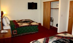 Postel nebo postele na pokoji v ubytování Juneau Hotel