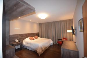 Ένα ή περισσότερα κρεβάτια σε δωμάτιο στο Amarilis Hotel Boutique