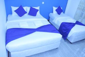 Кровать или кровати в номере Believe Inn
