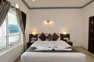 Posteľ alebo postele v izbe v ubytovaní B'Canti Boutique Beach Resort