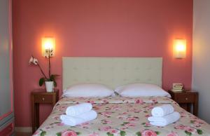 Ένα ή περισσότερα κρεβάτια σε δωμάτιο στο Amaryllis Hotel Apartments