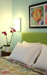 Ένα ή περισσότερα κρεβάτια σε δωμάτιο στο Amaryllis Hotel Apartments