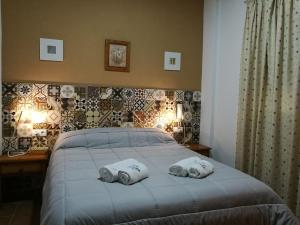 Postel nebo postele na pokoji v ubytování Hostal Canalejas