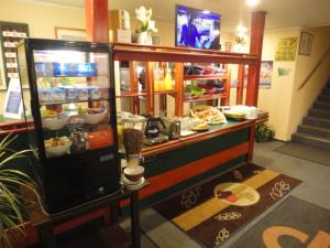 a food counter in a store with food in it at Quick Palace Epinal in Épinal