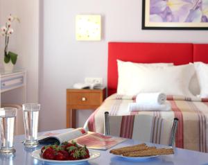 Ένα ή περισσότερα κρεβάτια σε δωμάτιο στο Amaryllis Hotel Apartments
