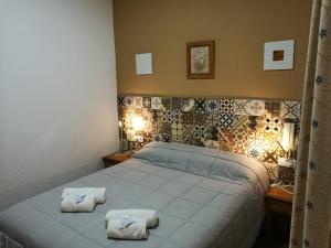 Postel nebo postele na pokoji v ubytování Hostal Canalejas