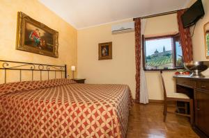 Ein Bett oder Betten in einem Zimmer der Unterkunft La Vecchia Fattoria