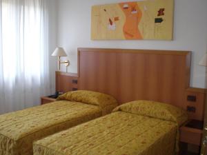 Llit o llits en una habitació de Locanda-Trattoria Al Rio