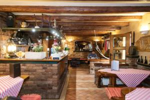 
a kitchen filled with lots of wooden furniture at Hotel Domino in Zagreb
