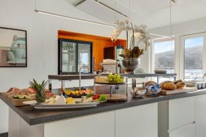 a kitchen with a buffet of food on a counter at Danhostel Vejle in Vejle
