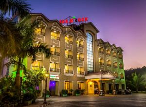 a hotel with a sign on top of it at Hotel Sea N Rock in Thane
