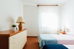 A bed or beds in a room at Residence Renaione