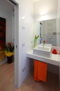 a bathroom with a white sink and a mirror at Ca degli Artisti in Trevignano +34 photos