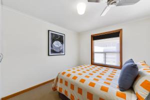 A bed or beds in a room at City Crashpad