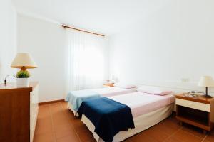 A bed or beds in a room at Residence Renaione