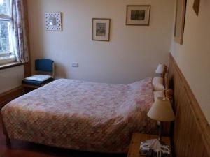 Postel nebo postele na pokoji v ubytování Acorn Guest House