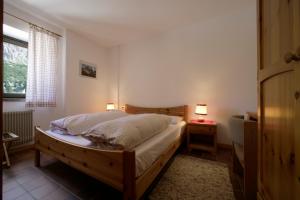 Postel nebo postele na pokoji v ubytování Hotel Garni Gonzaga