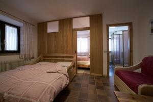 En eller flere senge i et værelse på Hotel Garni Gonzaga