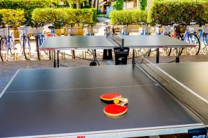 a ping pong table with a slice of fruit on it at Villa Delfa in Caorle