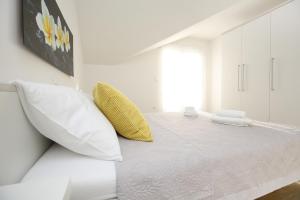 Postel nebo postele na pokoji v ubytování Apartments Nada