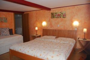 En eller flere senge i et værelse på Osteria Anzonico