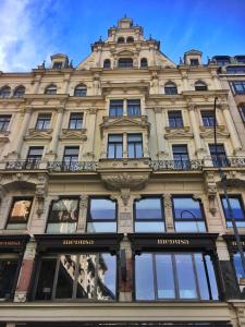 a building in the city of paris with a blue sky at Imperium Residence - Experience the most Luxurious Apartment in Vienna Center in Vienna