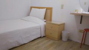 Postel nebo postele na pokoji v ubytování Chia Rong Hostel