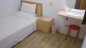 Postel nebo postele na pokoji v ubytování Chia Rong Hostel
