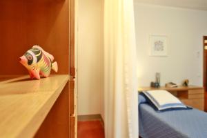 A bed or beds in a room at La Compagnia del Chianti