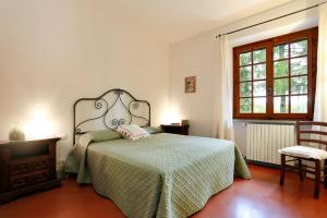 A bed or beds in a room at La Compagnia del Chianti