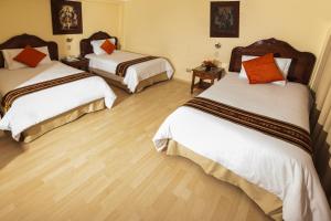 Voodi või voodid majutusasutuse Hotel Agustos Cusco toas