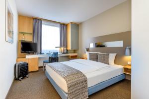 Postel nebo postele na pokoji v ubytování Mercure Hotel Düsseldorf City Nord