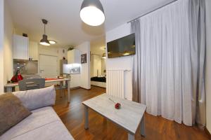 a living room with a couch and a table at Lipotica Luxury Accommodation in Zadar