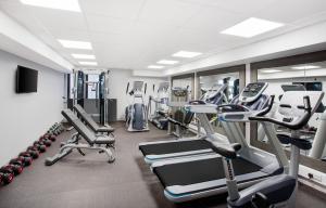a gym with several treadmills and cardio machines at Jurys Inn Aberdeen Airport in Dyce