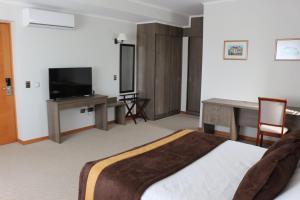 TV a/nebo společenská místnost v ubytování Conrado Hotel Osorno