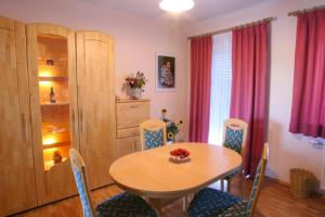 a dining room with a table and chairs at Spezialitätenhof Familie Eichmann in Neuhaus am Klausenbach +24 photos