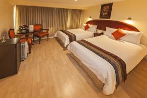 Voodi või voodid majutusasutuse Hotel Agustos Cusco toas