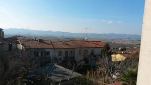 a view of a city with mountains in the background at Casa di Giulia (Bambini gratis fino a 6 anni) in Santa Luce