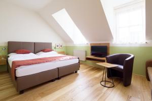 Postel nebo postele na pokoji v ubytování Weingut & Gästezimmer Edelmann