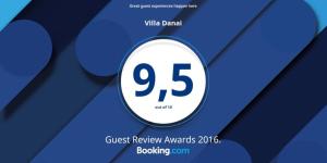 a close up of a sign that says guest review awards at Villa Danai in Agia Anna Naxos