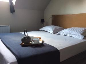 Postel nebo postele na pokoji v ubytování Manoir de La Muette