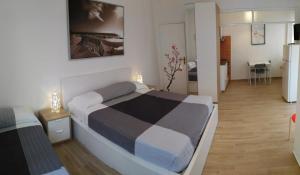 A bed or beds in a room at Residence Hotel Vittoria
