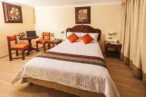 Voodi või voodid majutusasutuse Hotel Agustos Cusco toas