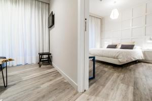 Łóżko lub łóżka w pokoju w obiekcie Hotel Boutique Teatro Romano