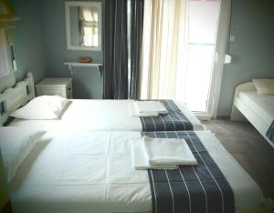 Postel nebo postele na pokoji v ubytování Vetti Rooms